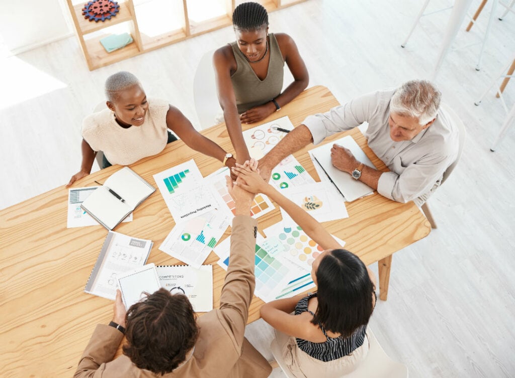 A group of people working together at a table
